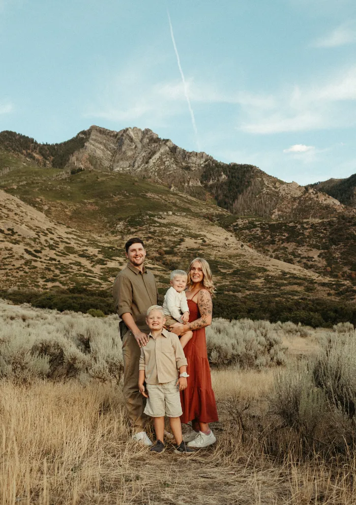 Jessica Bair, founder of Lavender + Honey Wellness, with her husband and two sons in the Utah mountains