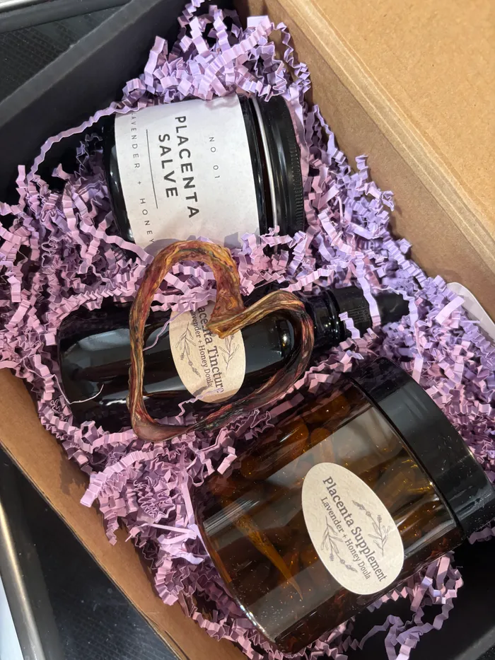 A finished placenta care package including salve, tincture, and encapsulated capsules